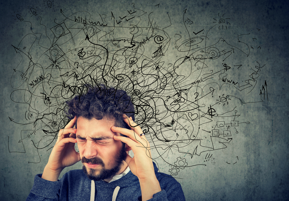 stressed man with head in his hands